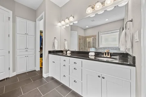 a bathroom with a toilet a sink and shower