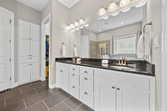 a bathroom with a toilet a sink and shower