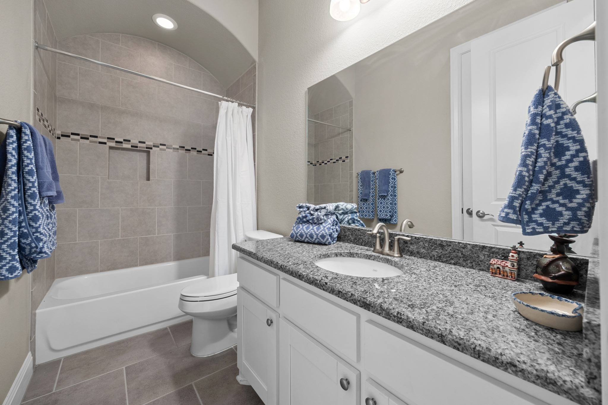 2114 Manada Trail Cedar Park, TX 78641 - Photo 23 of 36 a bathroom with a granite countertop double vanity sink toilet and shower