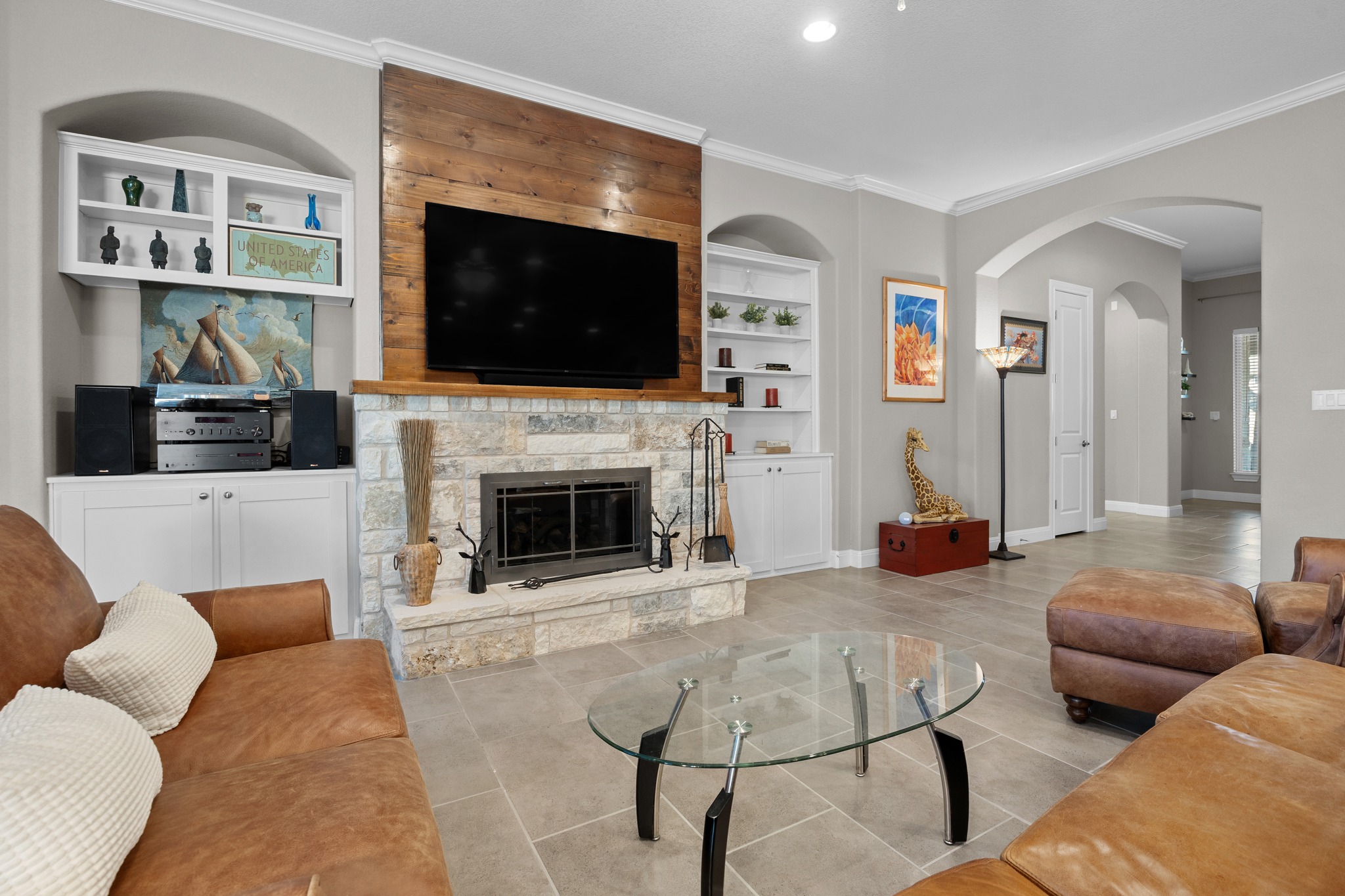 2114 Manada Trail Cedar Park, TX 78641 - Photo 34 of 36 a living room with furniture a flat screen tv and a fireplace