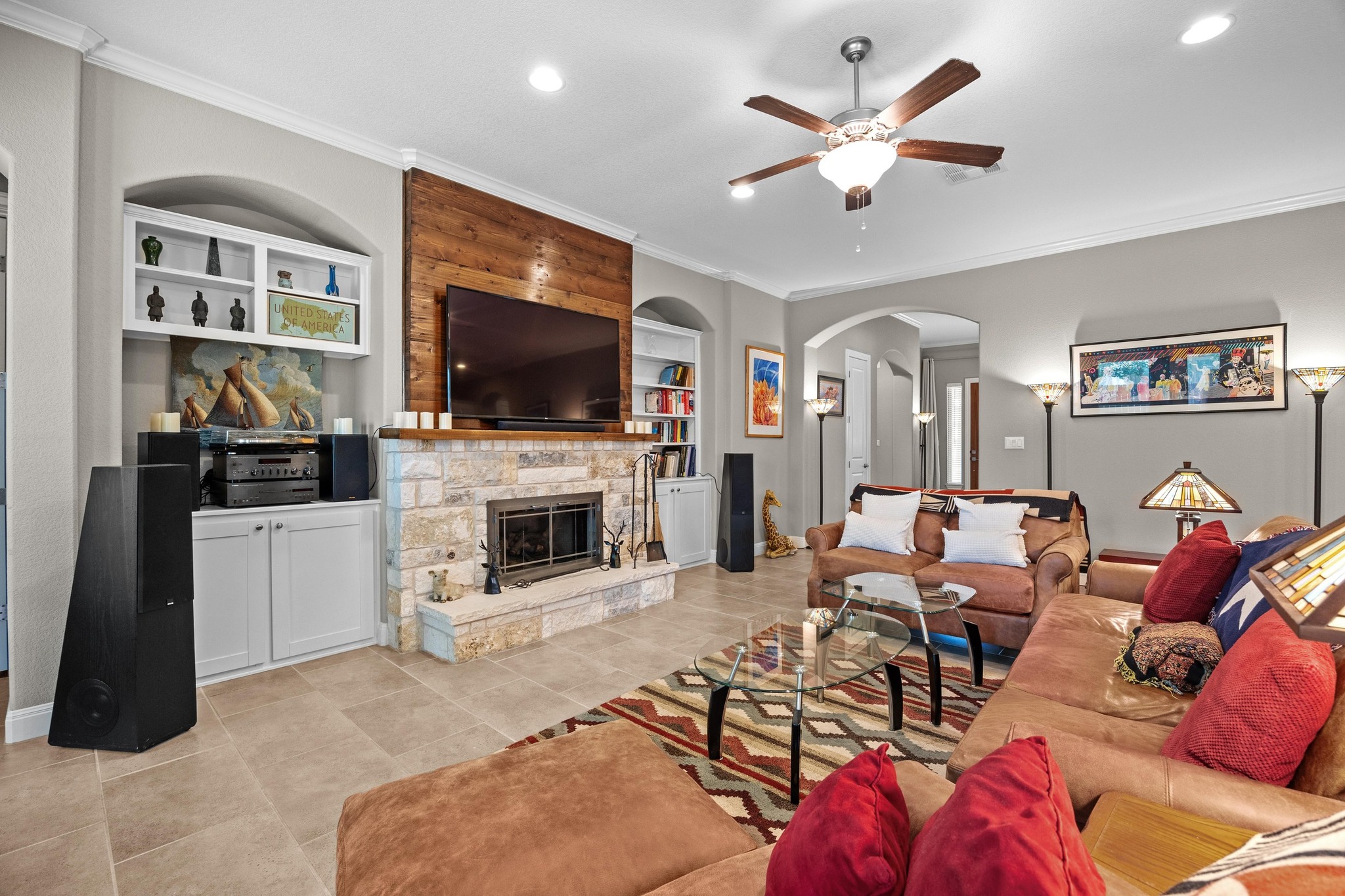 2114 Manada Trail Leander, TX 78641 - Photo 10 of 36 a living room with furniture a flat screen tv and a fireplace