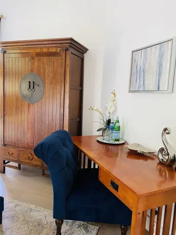 a dining room with a table and chairs