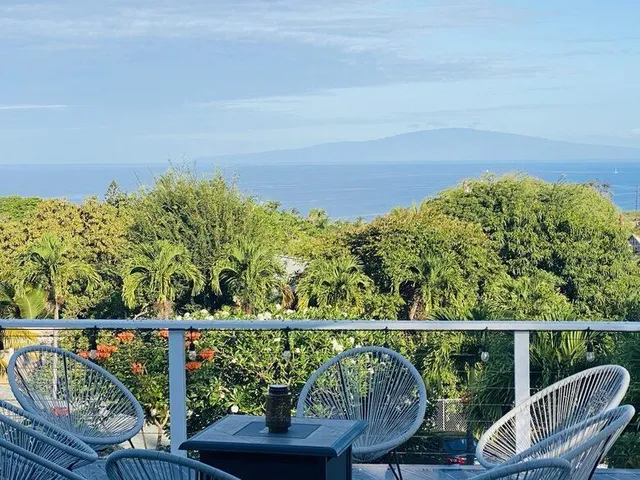 a view of a balcony with chairs