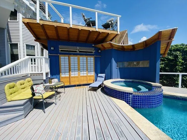 swimming pool view with a seating space