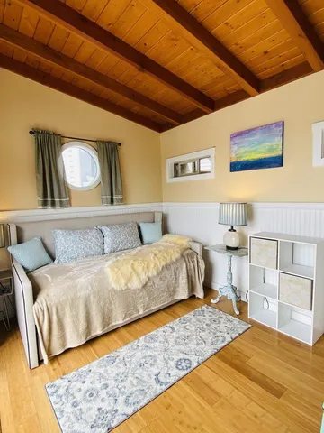 a bedroom with a bed and dresser