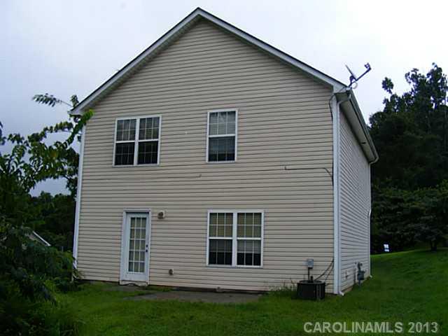 831 Valley Ridge Road Charlotte, NC 28214 - Photo 12 of 12 a view of a house with a yard