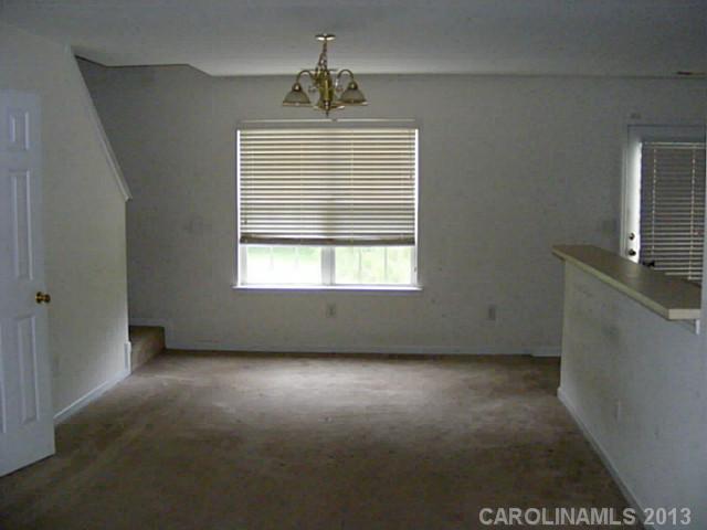 831 Valley Ridge Road Charlotte, NC 28214 - Photo 3 of 12 a view of an empty room with a window