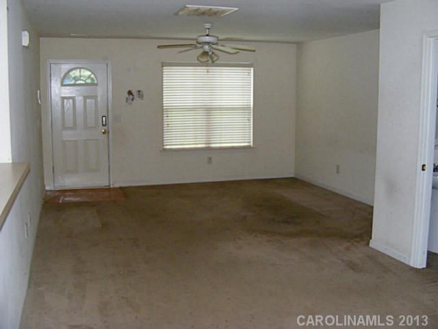 831 Valley Ridge Road Charlotte, NC 28214 - Photo 4 of 12 an empty room with a window