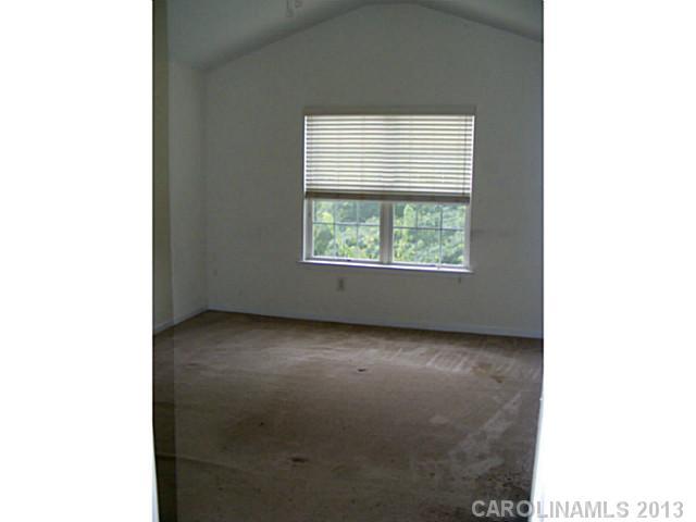 831 Valley Ridge Road Charlotte, NC 28214 - Photo 5 of 12 a view of a room that has a window in it