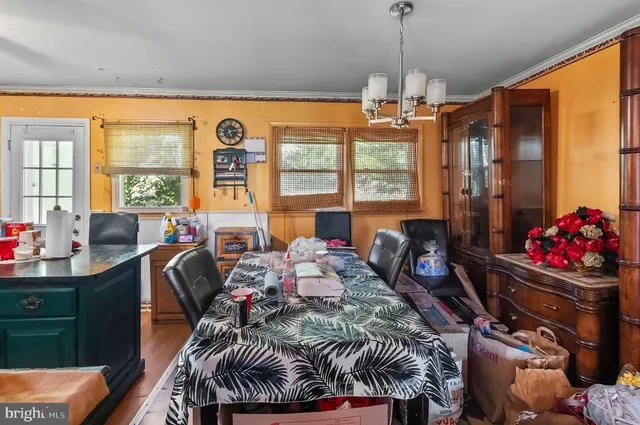 a room with furniture toys and a large window
