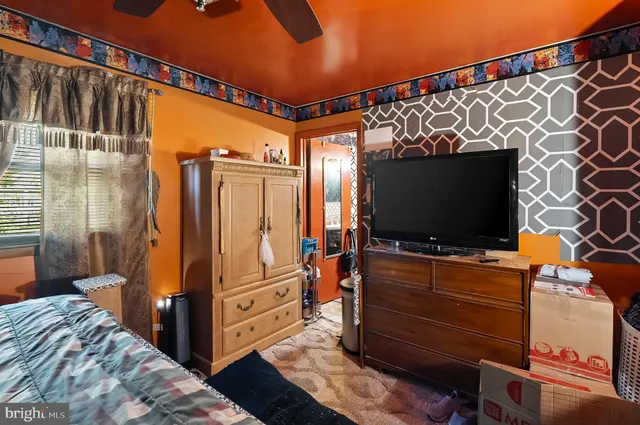 a room with furniture and a flat screen tv