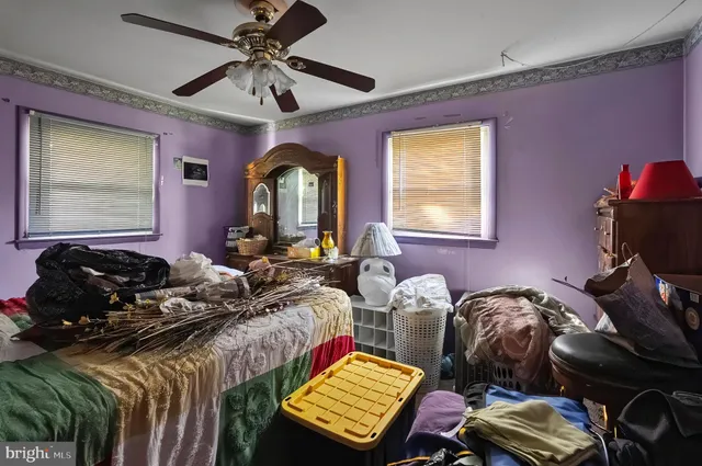 a bedroom with furniture and a window