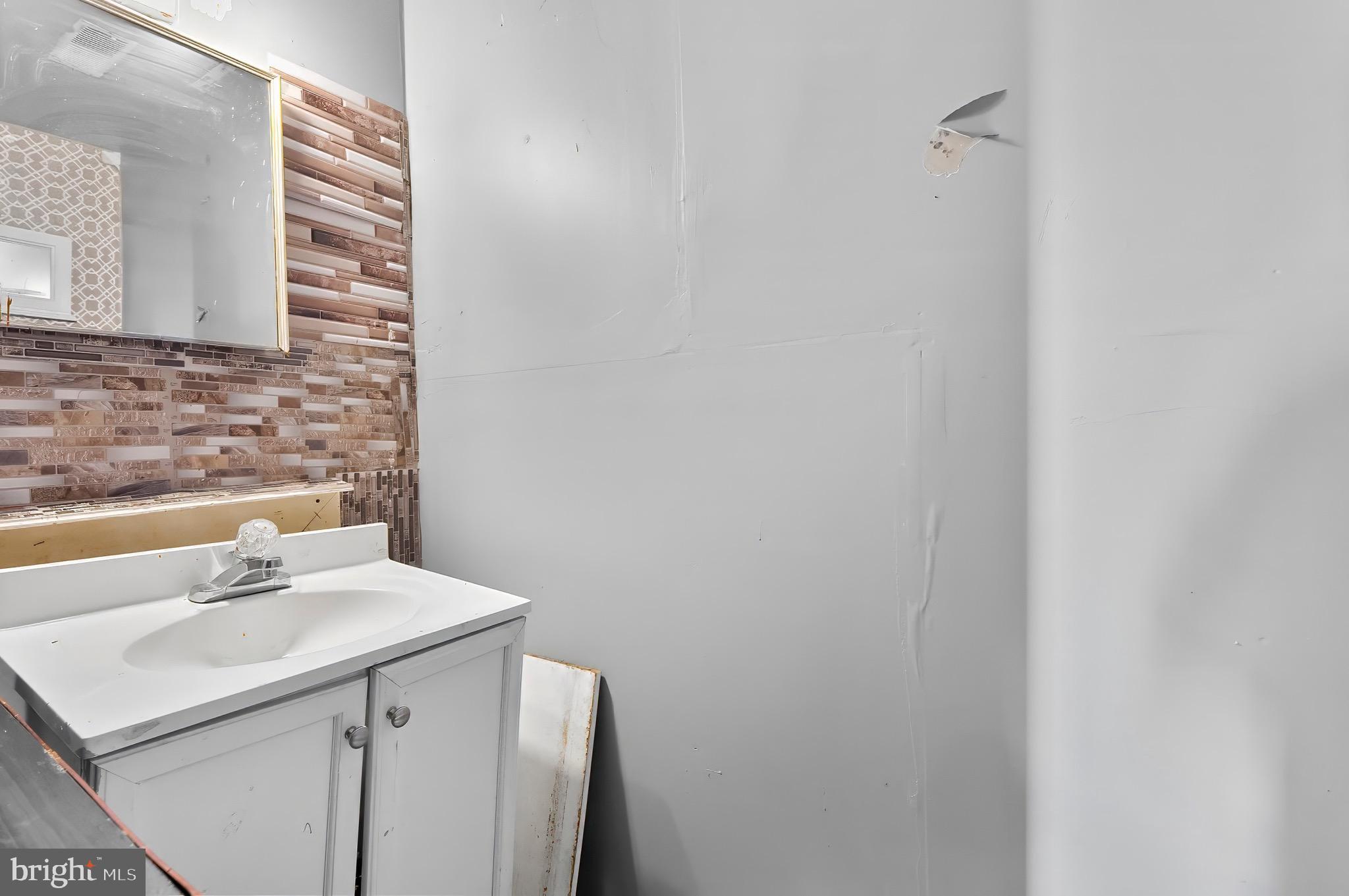 1715 Walker Road Freeland, MD 21053 - Photo 27 of 31 a bathroom with a sink and a mirror