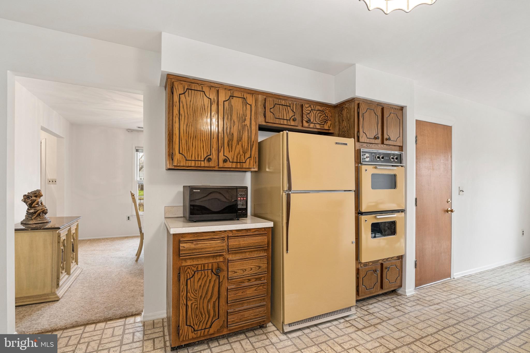 4 David Drive Ewing, NJ 08638 - Photo 11 of 32 a kitchen with stainless steel appliances granite countertop a refrigerator a stove and a sink with wooden floor