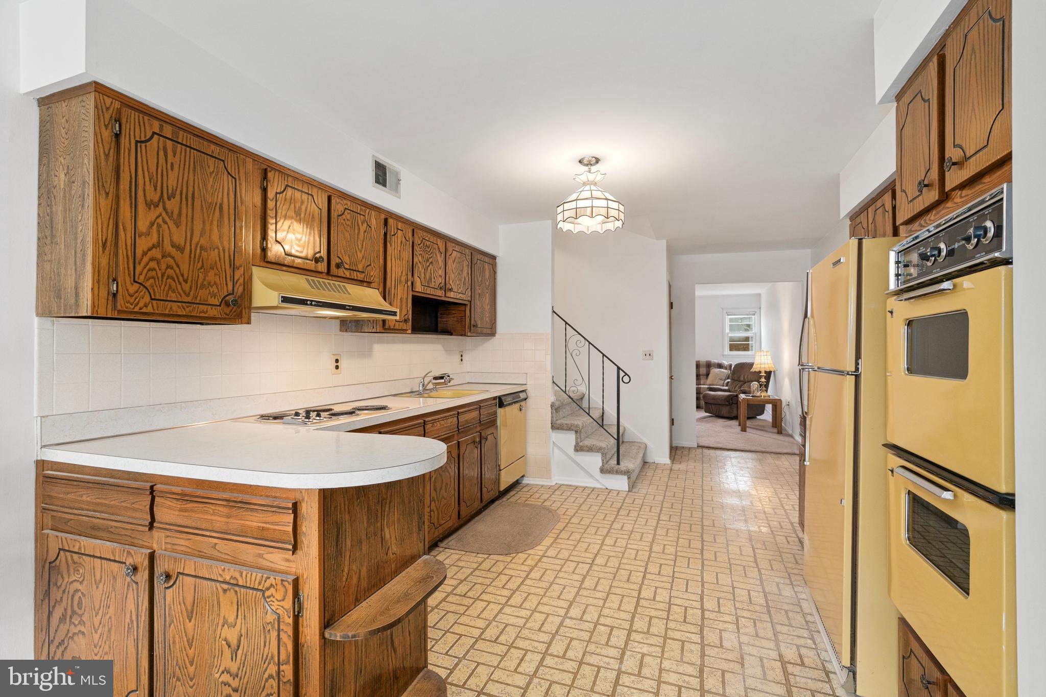 4 David Drive Ewing, NJ 08638 - Photo 12 of 32 a kitchen with stainless steel appliances granite countertop a stove a sink and a refrigerator