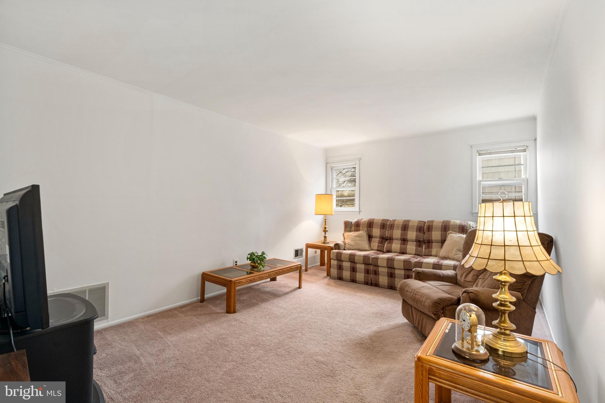 4 David Drive Ewing, NJ 08638 - Photo 14 of 32 a living room with furniture and a flat screen tv