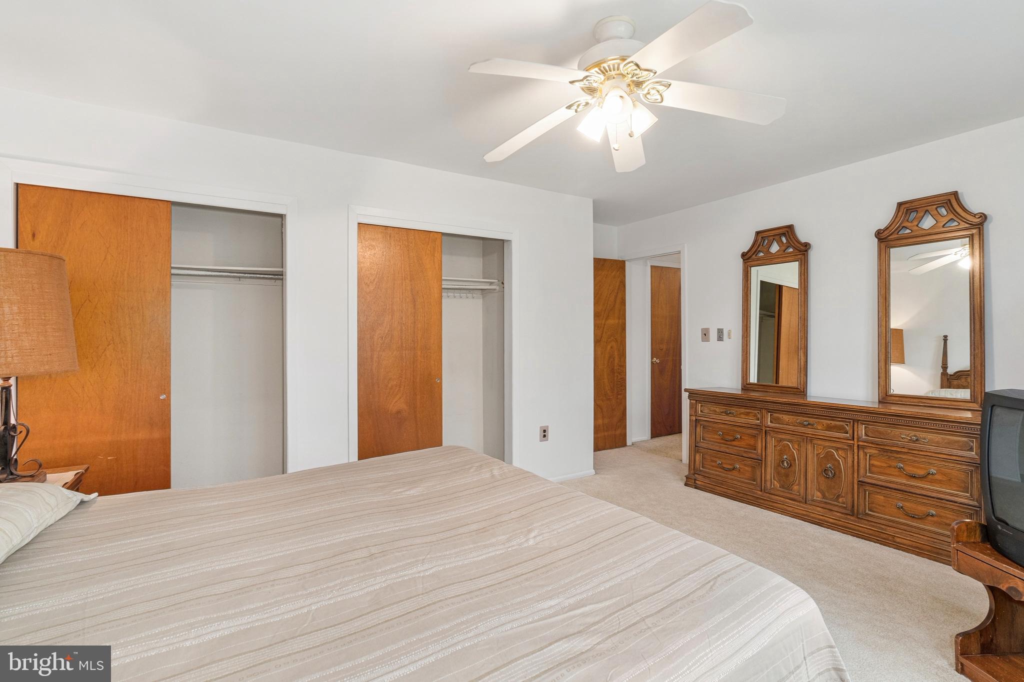 4 David Drive Ewing, NJ 08638 - Photo 18 of 32 a bedroom with a large bed and a chandelier