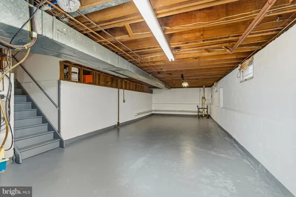 a view of an empty room with stairs