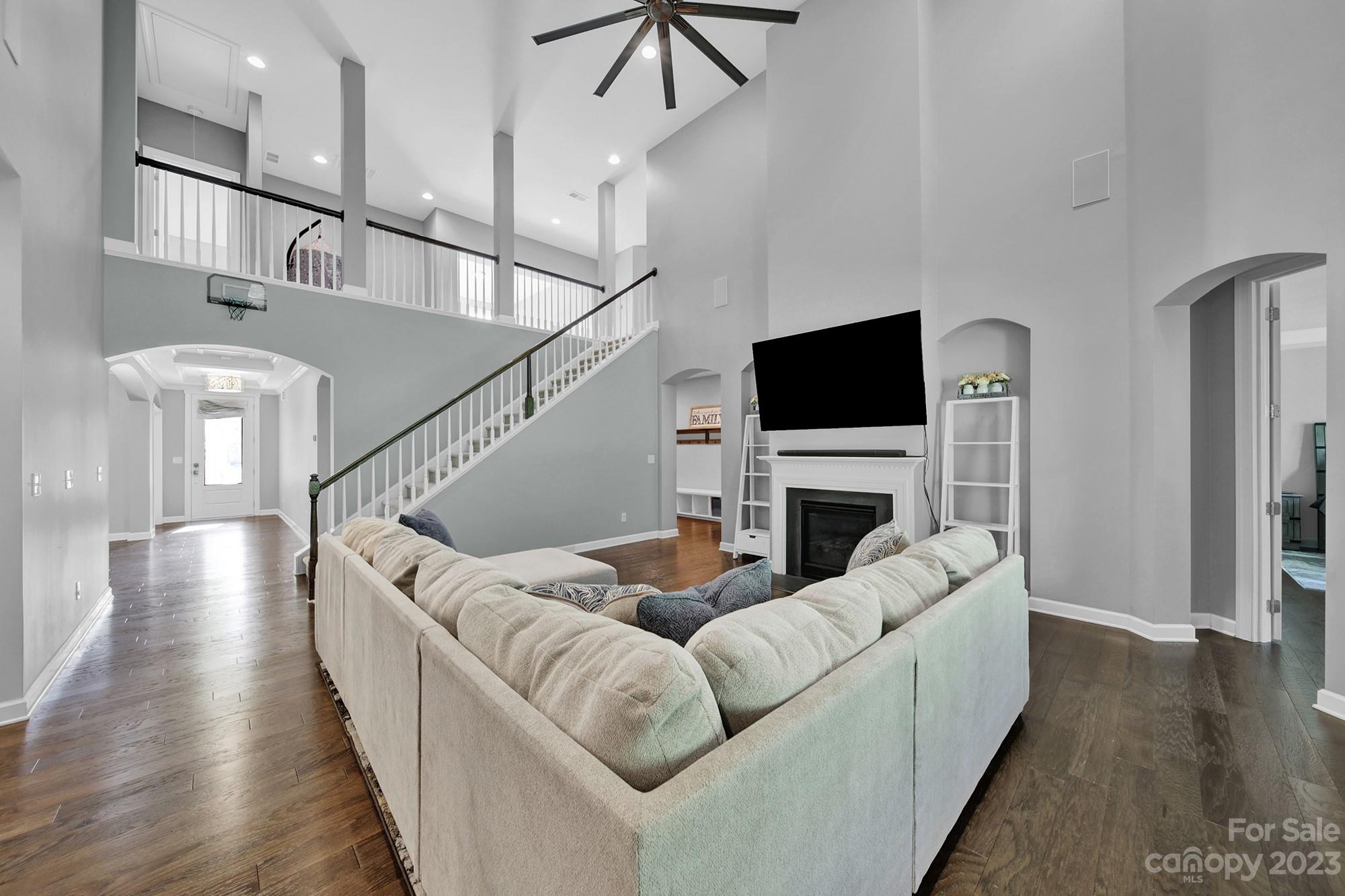 1516 Hazel Street Tega Cay, SC 29708 - Photo 23 of 48 a living room with fireplace furniture and a flat screen tv