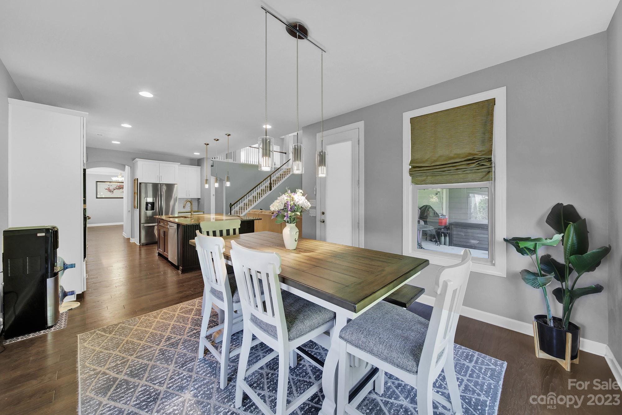 1516 Hazel Street Tega Cay, SC 29708 - Photo 24 of 48 a view of a dining room with furniture