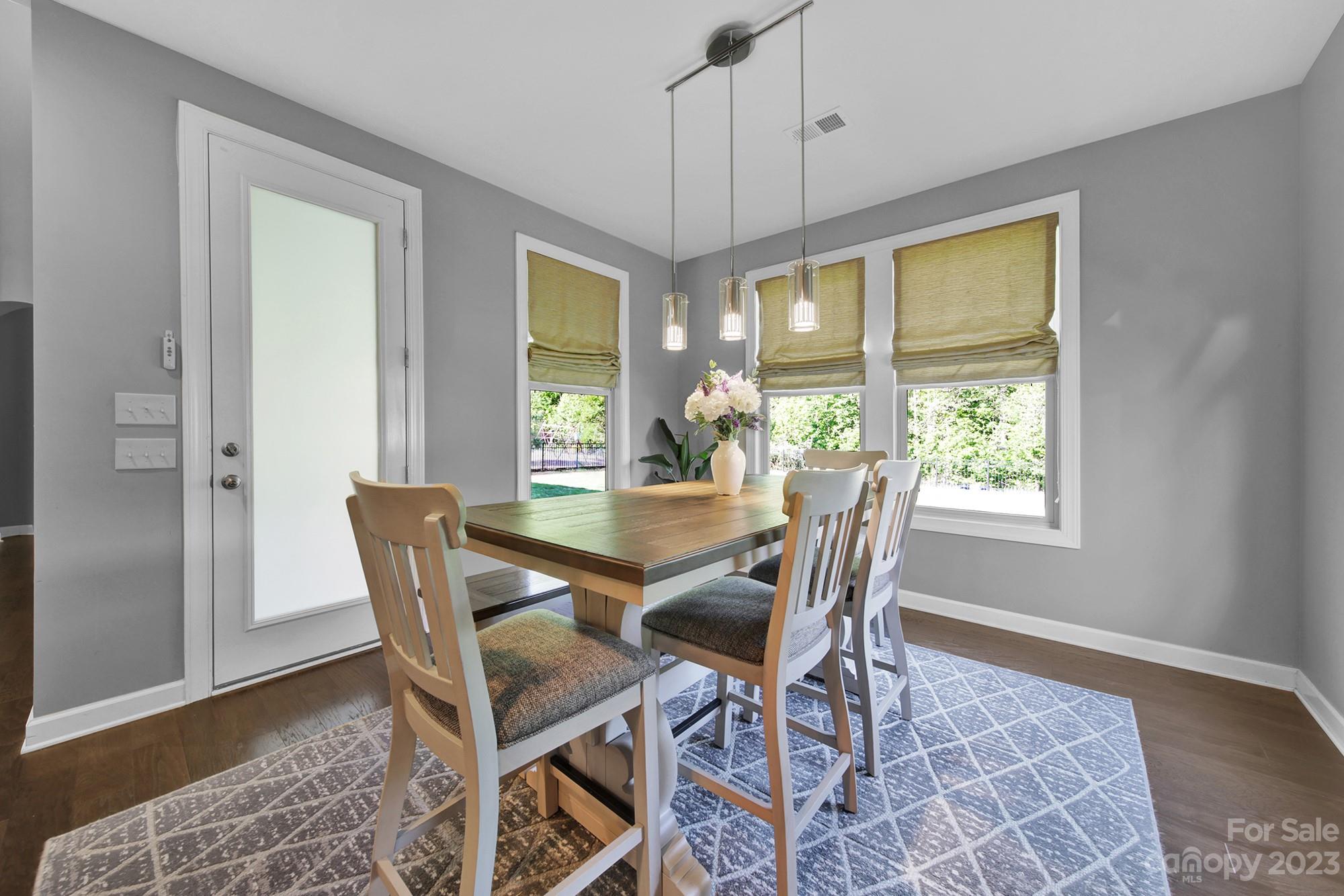 1516 Hazel Street Tega Cay, SC 29708 - Photo 25 of 48 a view of a dining room with furniture window and outside view