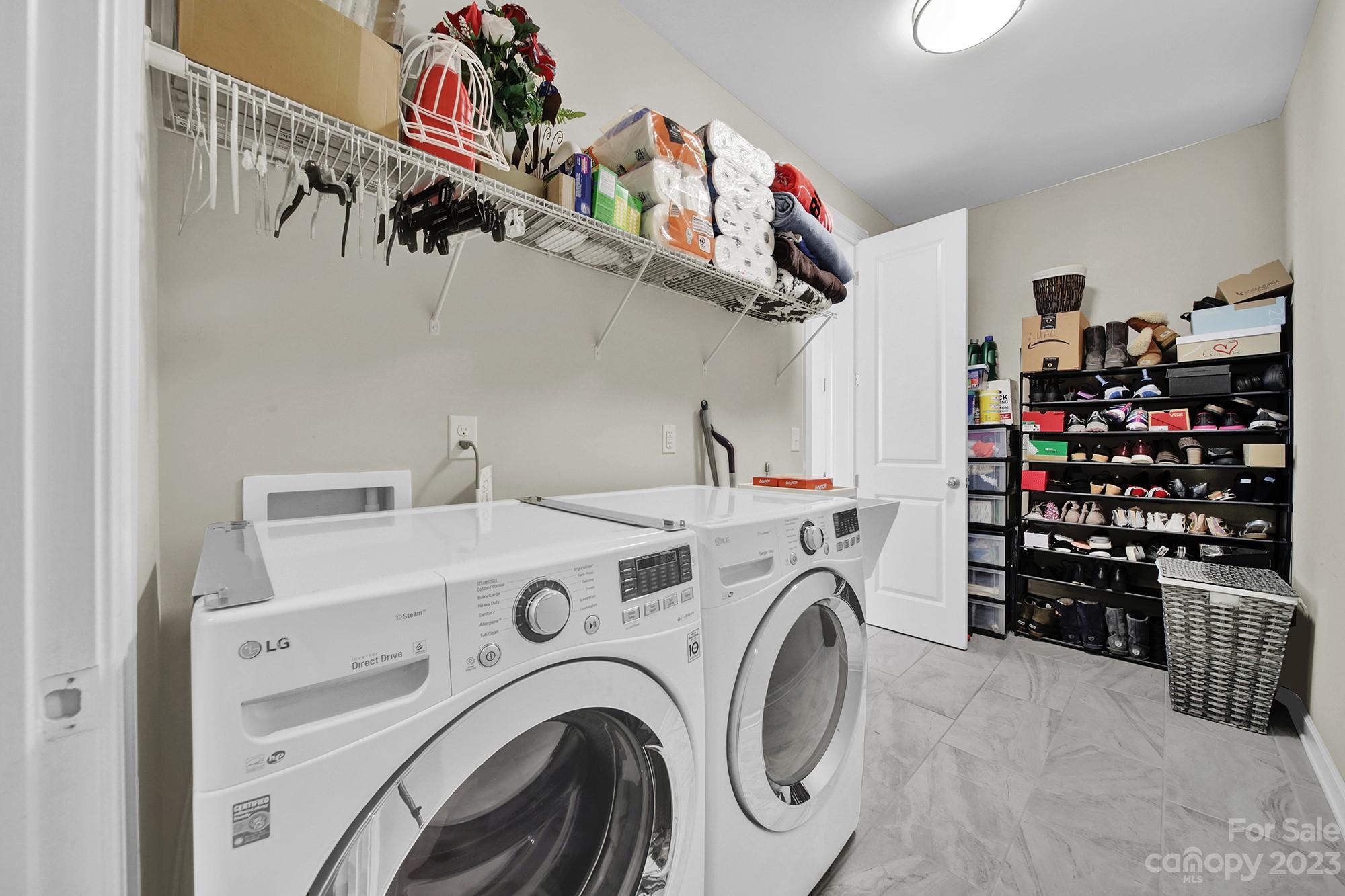 1516 Hazel Street Tega Cay, SC 29708 - Photo 30 of 48 a view of storage and utility room with washer and dryer