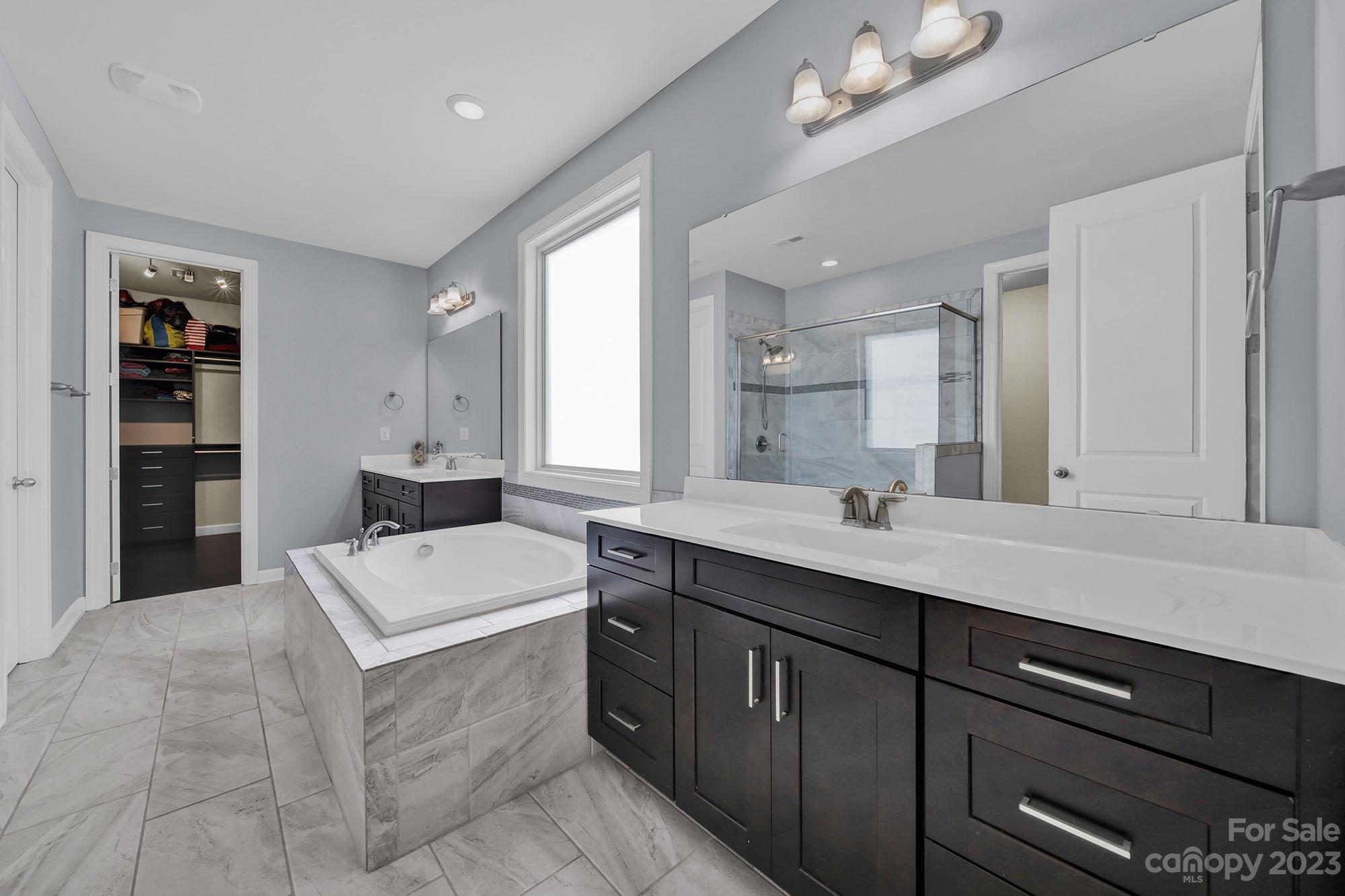 1516 Hazel Street Tega Cay, SC 29708 - Photo 32 of 48 a bathroom with a sink double vanity granite and a mirror