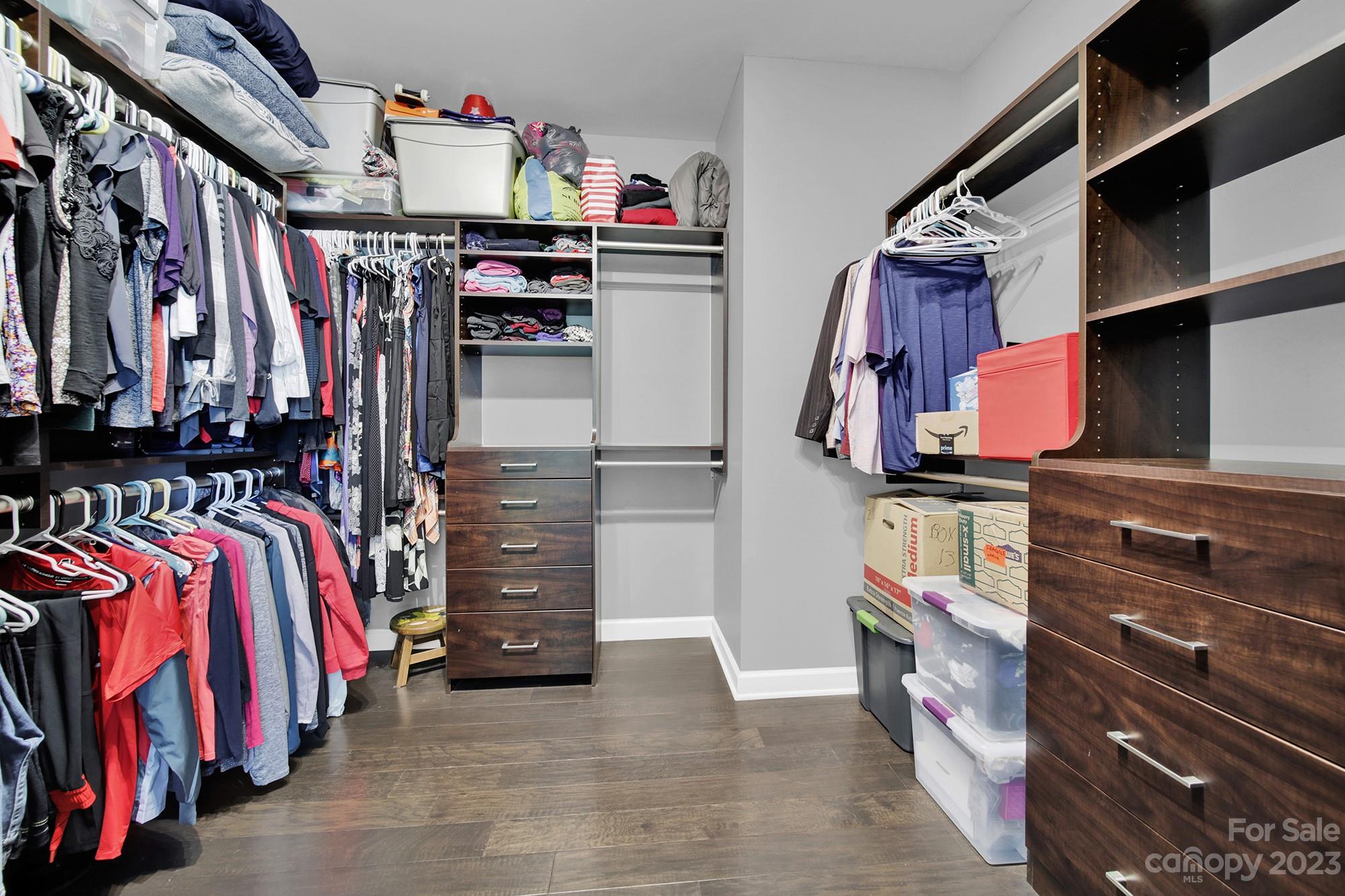 1516 Hazel Street Tega Cay, SC 29708 - Photo 34 of 48 a view of walk in closet with clothes and shoes