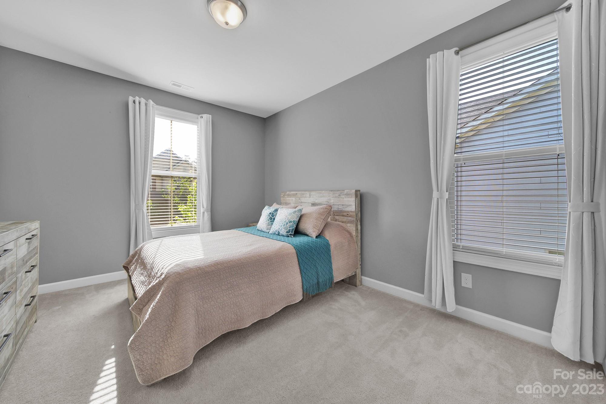 1516 Hazel Street Tega Cay, SC 29708 - Photo 47 of 48 a spacious bedroom with a bed and a window