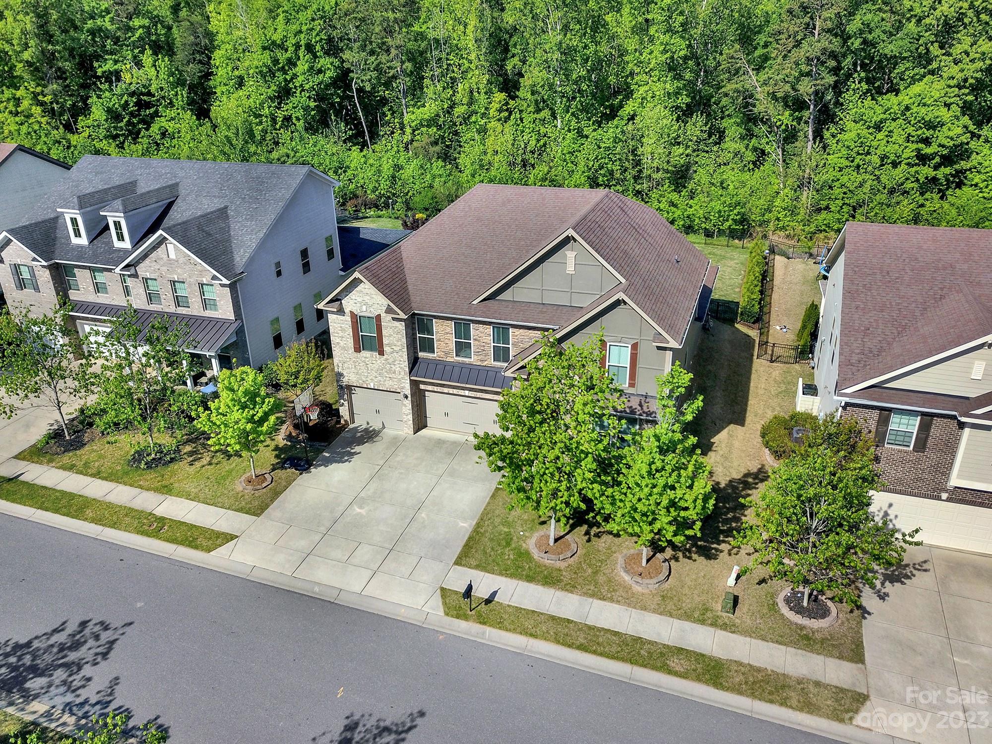 1516 Hazel Street Tega Cay, SC 29708 - Photo 5 of 48 an aerial view of a house with a yard and a bench