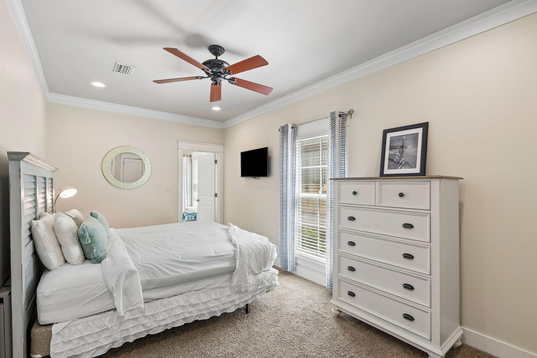 39 Willow Mist Road Inlet Beach, FL 32461 - Photo 13 of 41 a bedroom with a bed and ceiling fan
