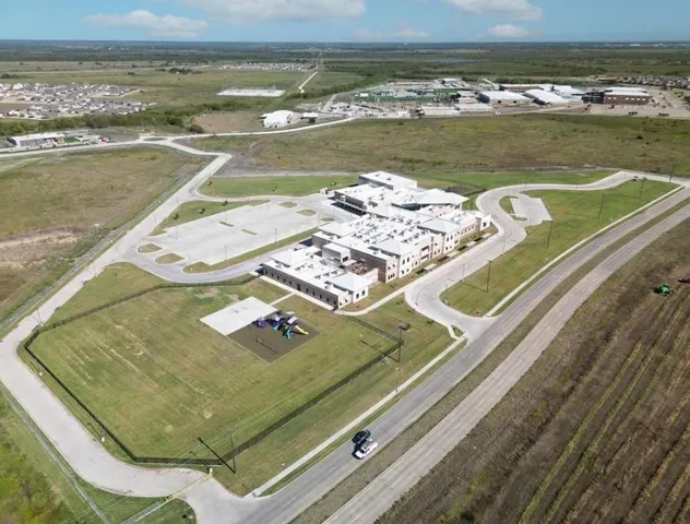 a view of a pool an ocean from a terrace
