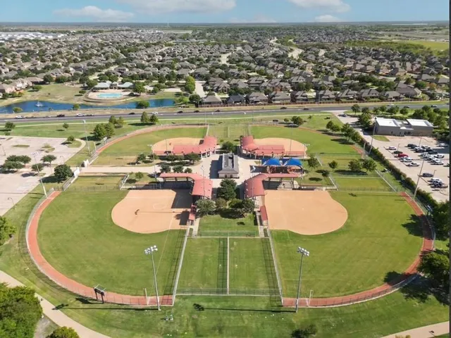an aerial view of a pool a yard swimming pool and outdoor seating
