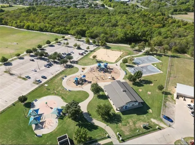 an aerial view of a house with outdoor space