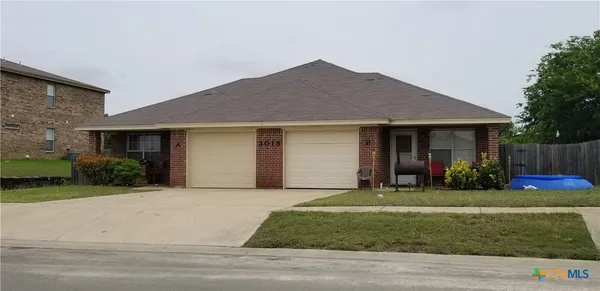 a view of a house with a patio