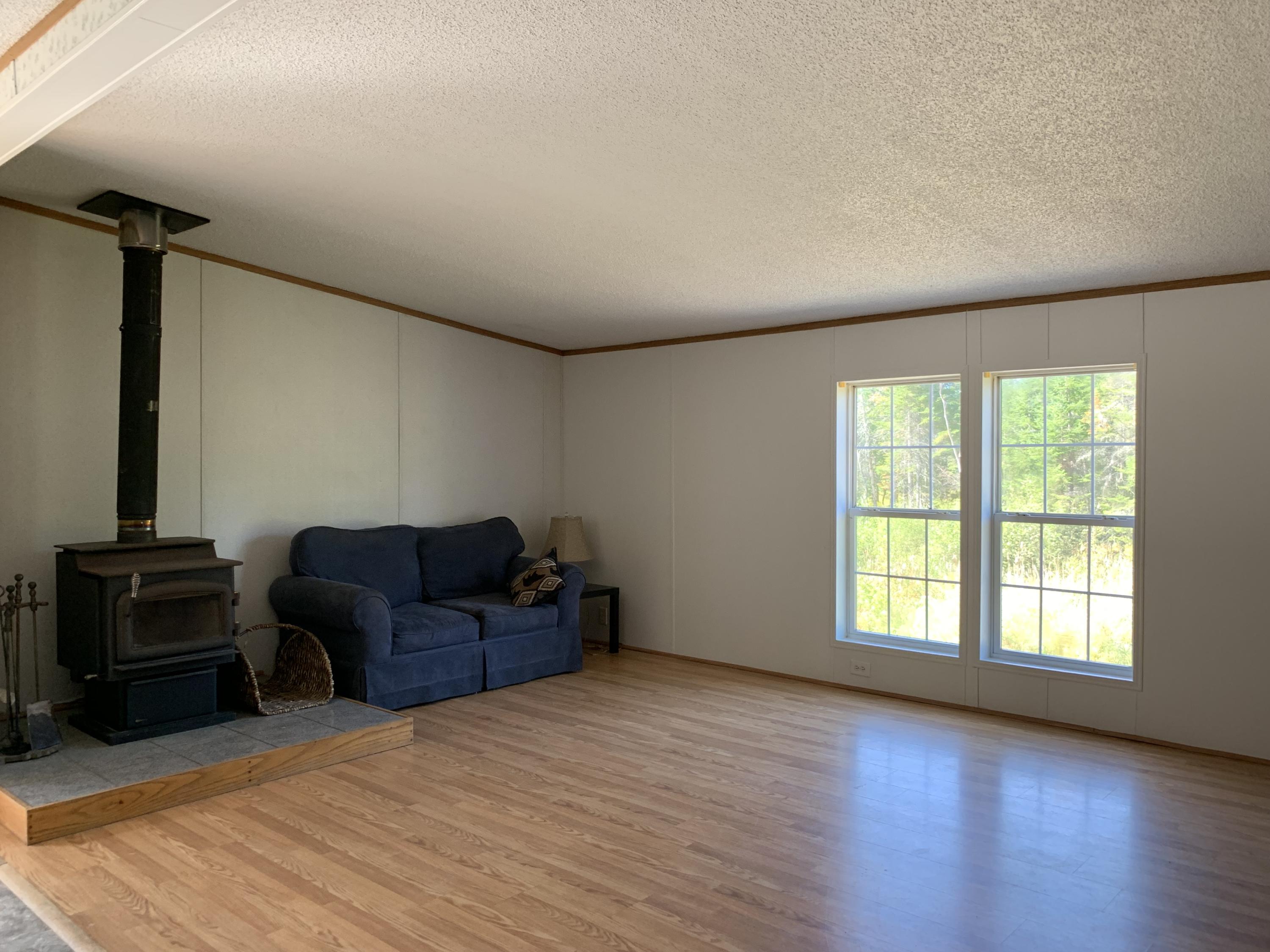 528 Dover Road Charleston, ME 04422 - Photo 7 of 28 Living Room with Wood Stove