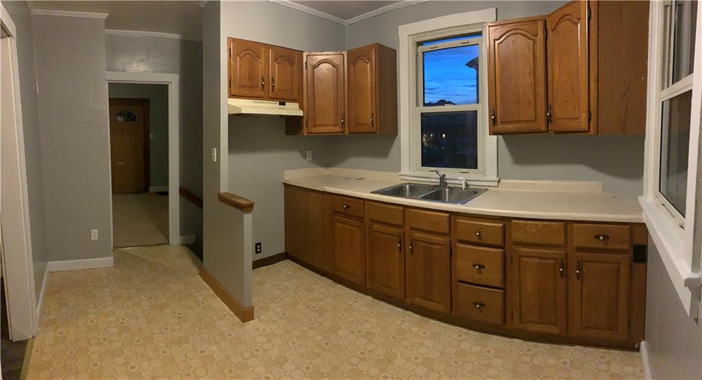 5 Carnegie Drive Midland, PA 15059 - Photo 3 of 18 a bathroom with a sink and a mirror