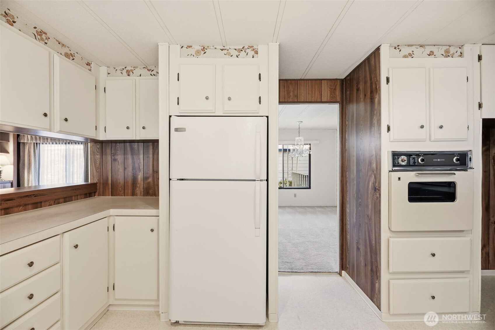 620 112th Street Southeast, Unit 205 Everett, WA 98208 - Photo 12 of 34 a white refrigerator freezer sitting in a kitchen