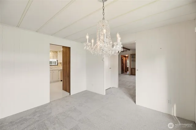 a view of a livingroom with a ceiling fan and a window