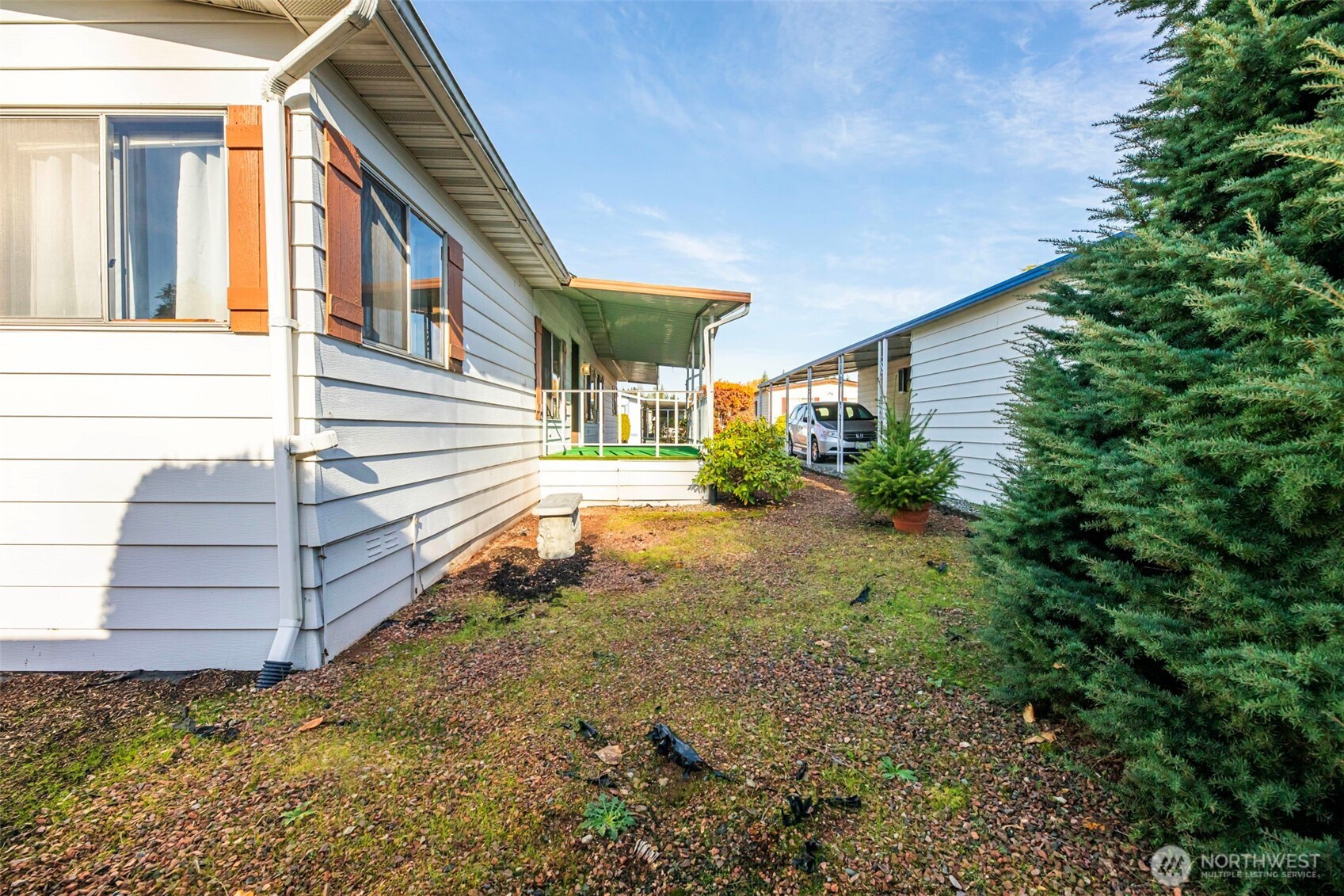620 112th Street Southeast, Unit 205 Everett, WA 98208 - Photo 29 of 34 a view of a house with a yard and sitting area