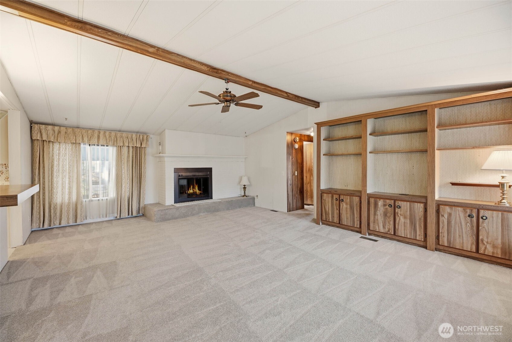 620 112th Street Southeast, Unit 205 Everett, WA 98208 - Photo 5 of 34 a view of an empty room with a fireplace and a window