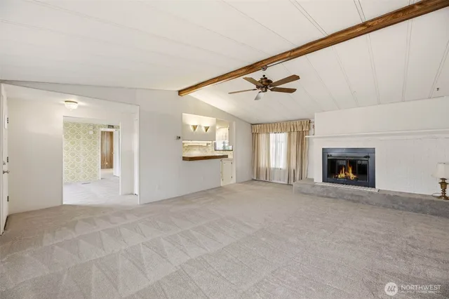 a view of a kitchen with a sink and a refrigerator