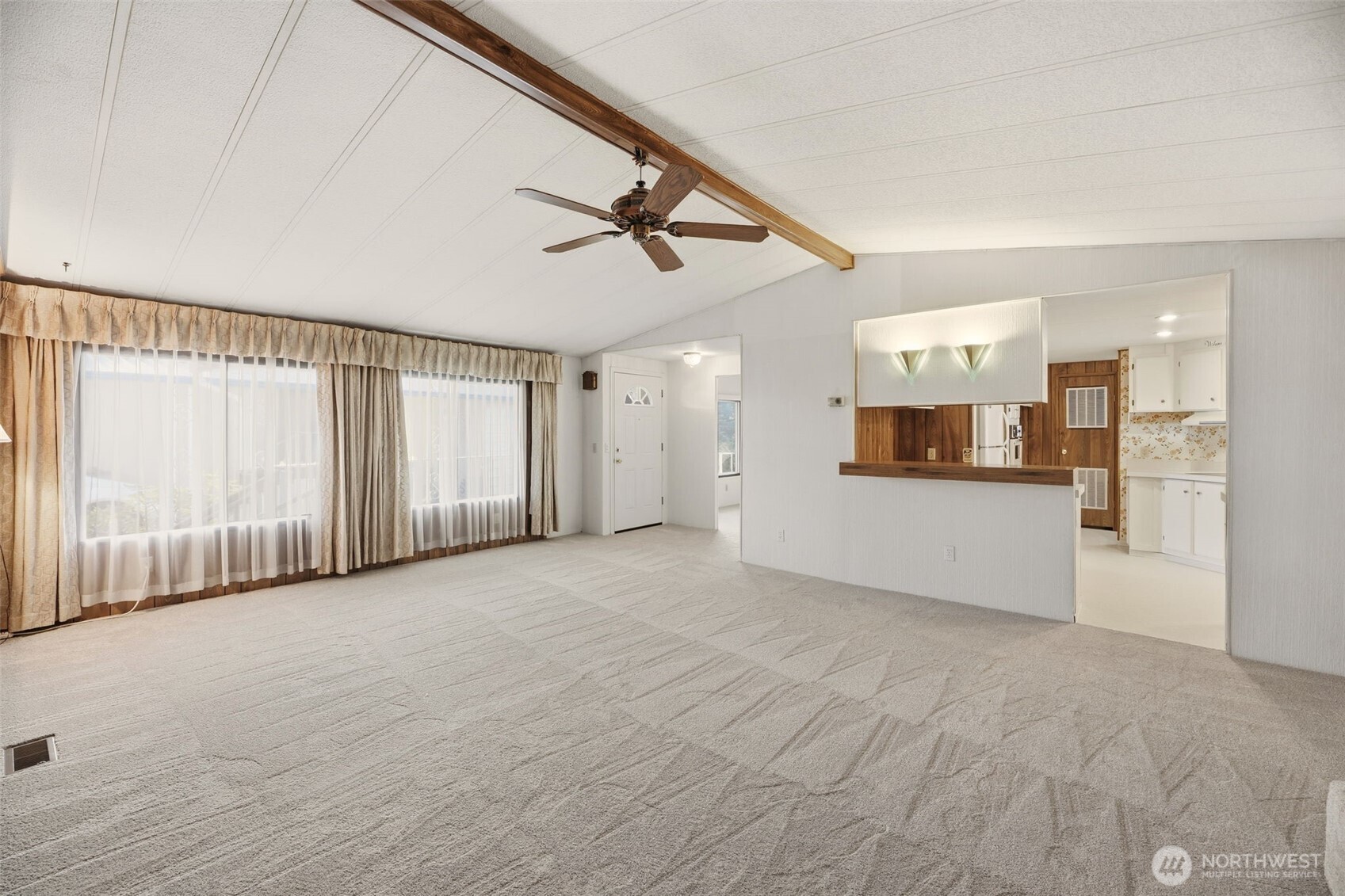620 112th Street Southeast, Unit 205 Everett, WA 98208 - Photo 7 of 34 a view of a kitchen with a sink and a refrigerator