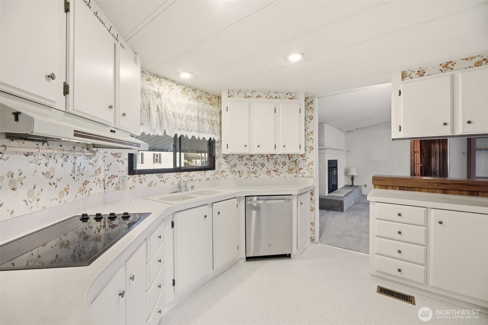 620 112th Street Southeast, Unit 205 Everett, WA 98208 - Photo 10 of 34 a kitchen with granite countertop a sink stove and cabinets
