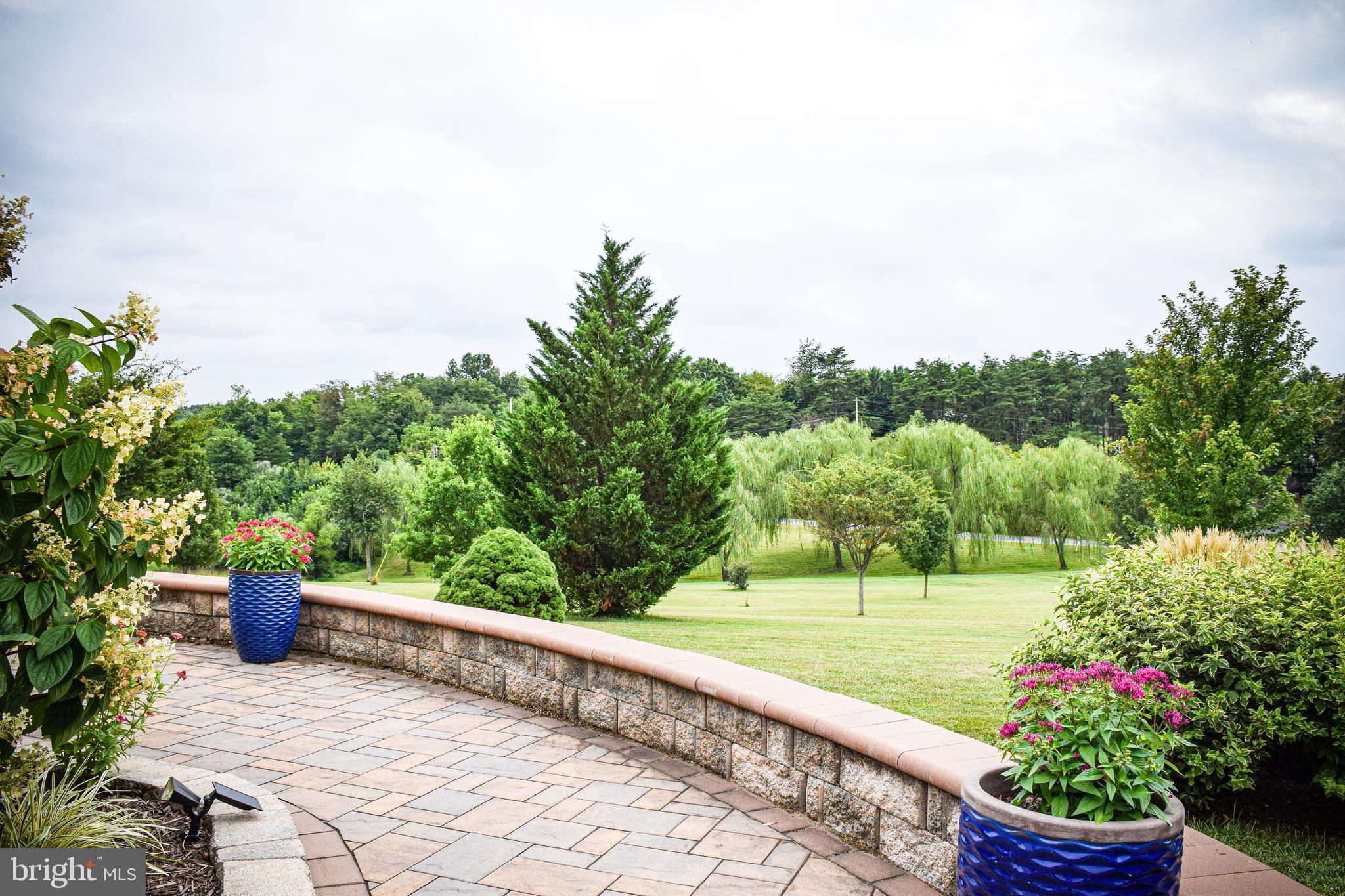 765 Gun Club Road Stephenson, VA 22656 - Photo 103 of 113 a view of a garden with an outdoor seating
