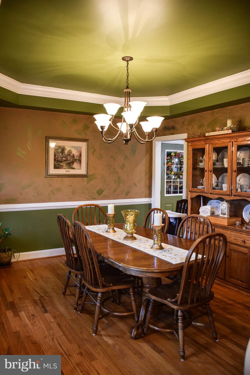 765 Gun Club Road Stephenson, VA 22656 - Photo 15 of 113 a view of a dining room with furniture and window