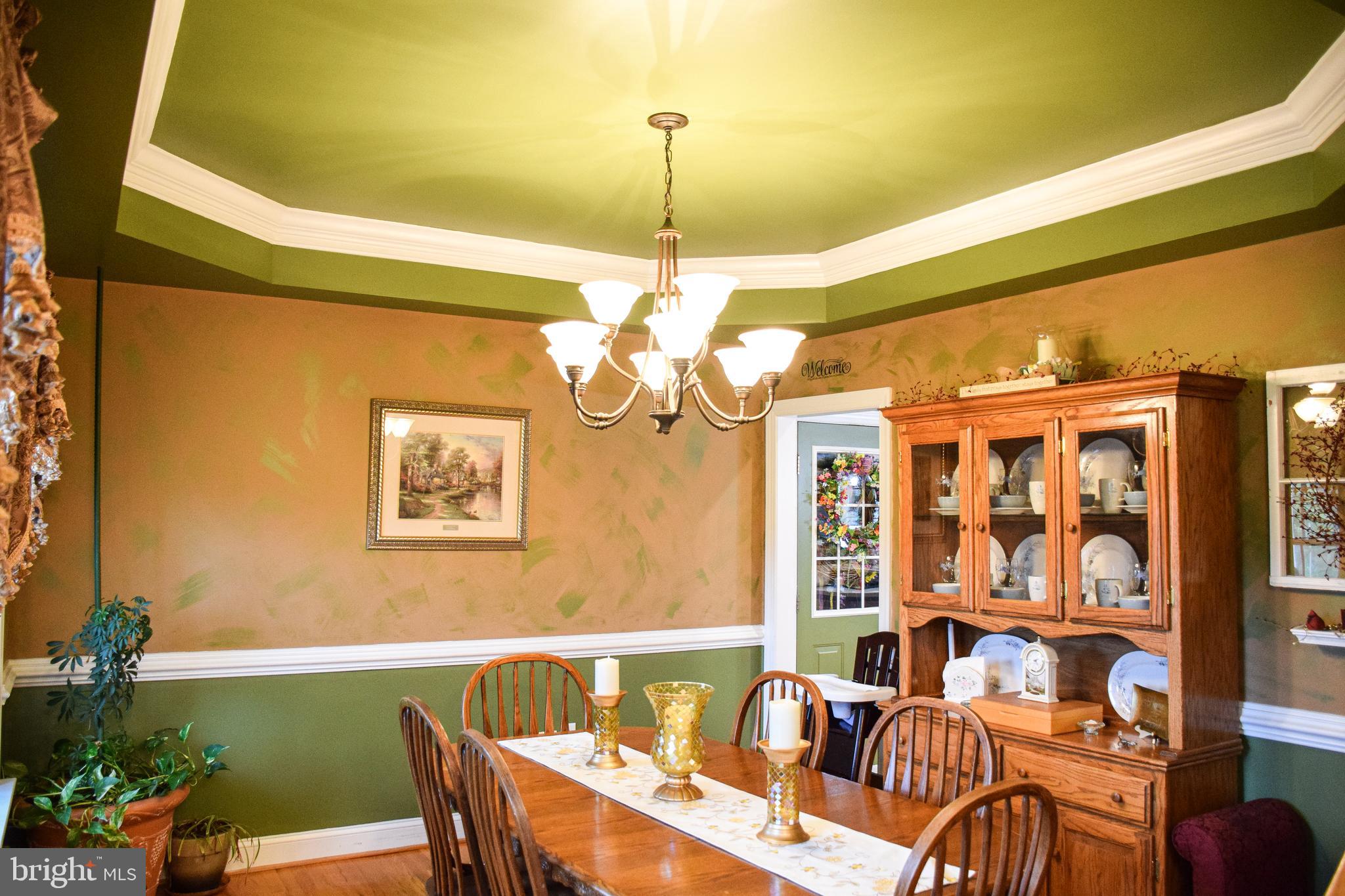 765 Gun Club Road Stephenson, VA 22656 - Photo 21 of 113 a view of a dining room with furniture window and outside view