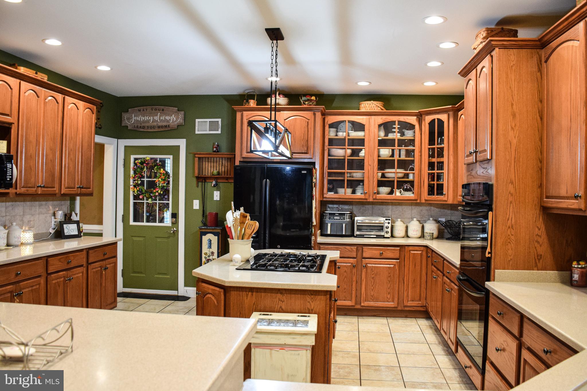 765 Gun Club Road Stephenson, VA 22656 - Photo 23 of 113 a kitchen with stainless steel appliances kitchen island granite countertop a sink and cabinets