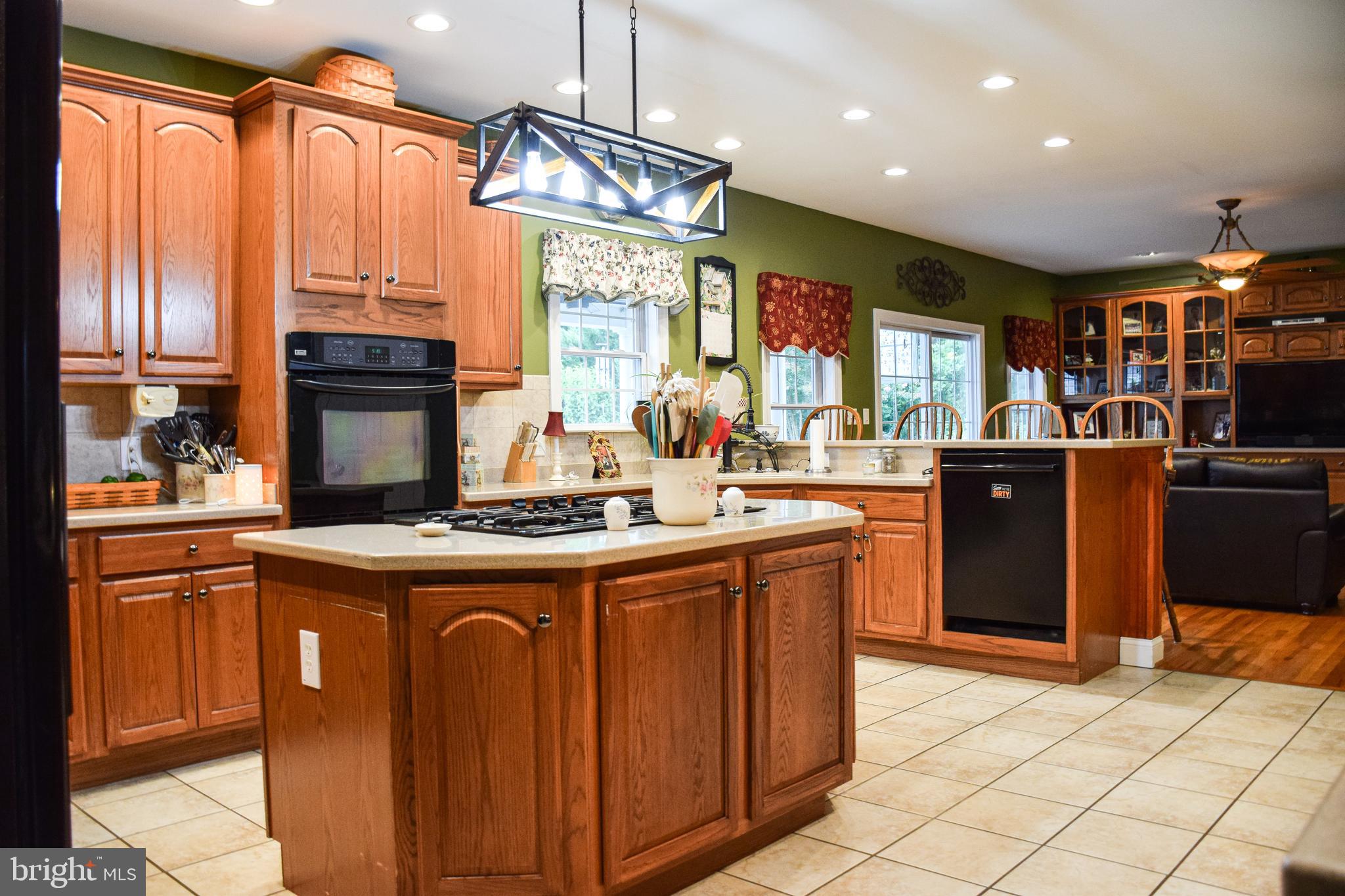 765 Gun Club Road Stephenson, VA 22656 - Photo 25 of 113 a kitchen with stainless steel appliances granite countertop a stove and a refrigerator