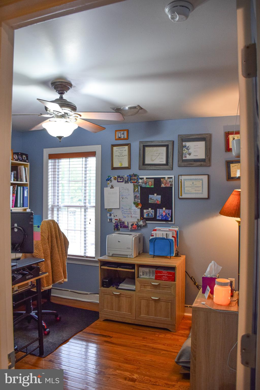 765 Gun Club Road Stephenson, VA 22656 - Photo 46 of 113 a living room with furniture and a flat screen tv
